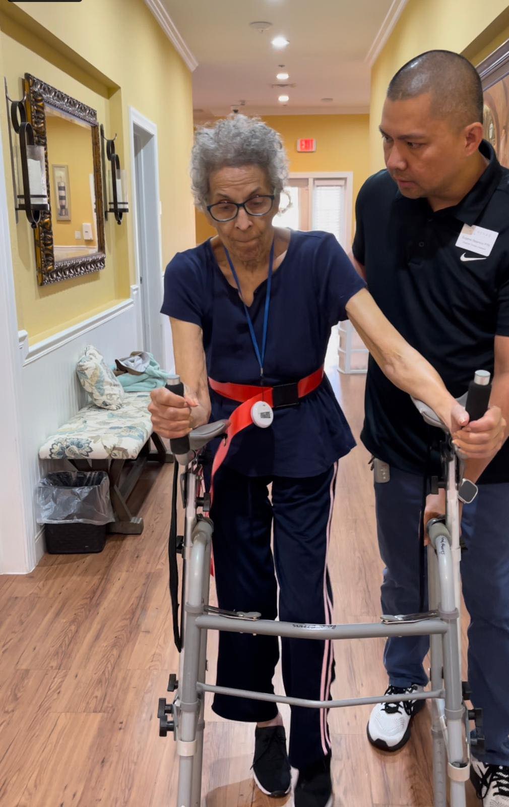 caregiver helping a resident to walk