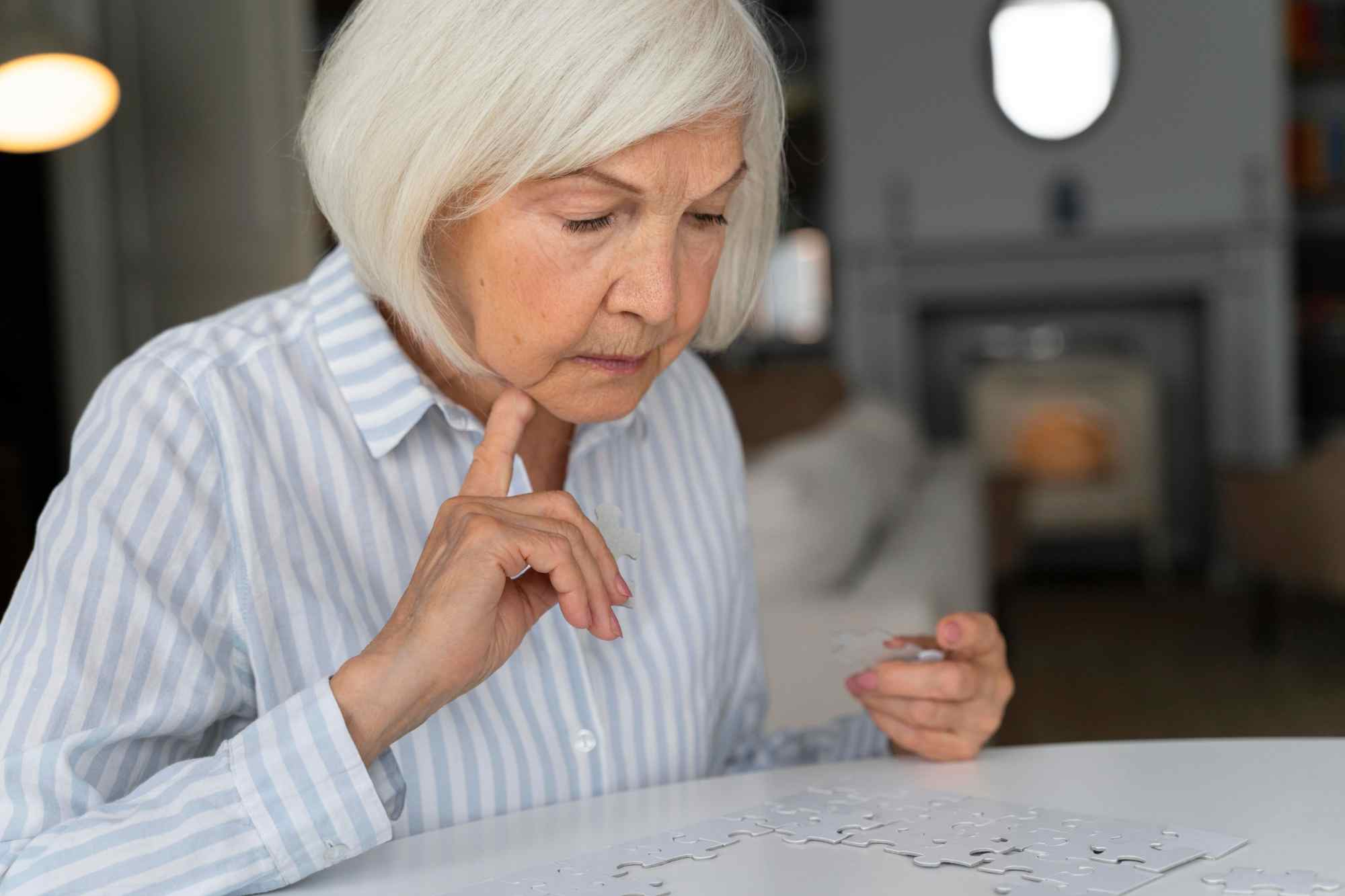 old lady with alzheimer playing puzzle