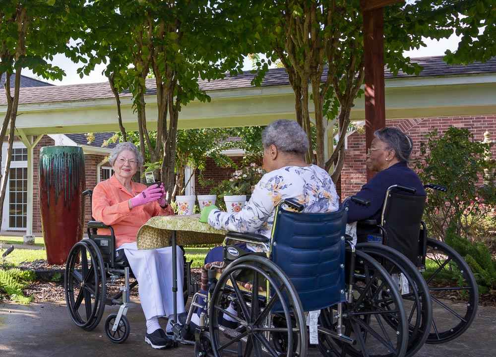 Disabled adults care sitting on a wheelchair and having an activity